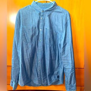 Calvin Klein long sleeve button up shirt with snap buttons. Very stylish design